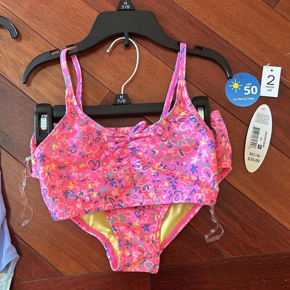 Girls set of swimsuits, pink set is a 7/8 and the one piece is a small. - Picture 3 of 11